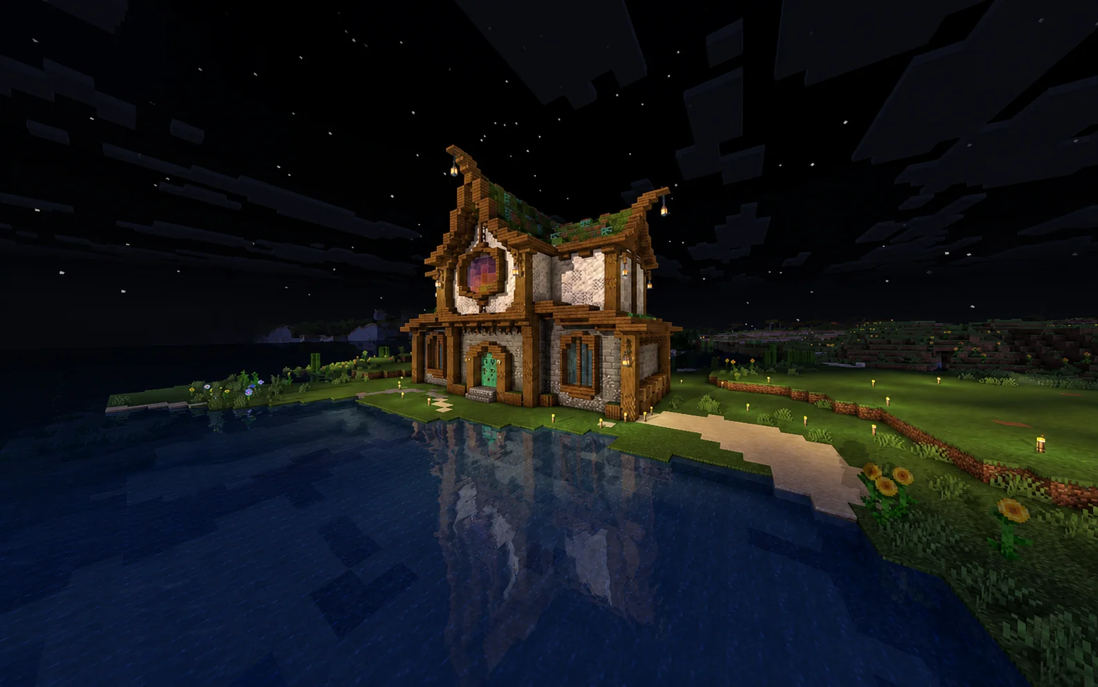 Een verlicht Minecraft bouwwerk aan een meer, gemaakt op MolenCraft